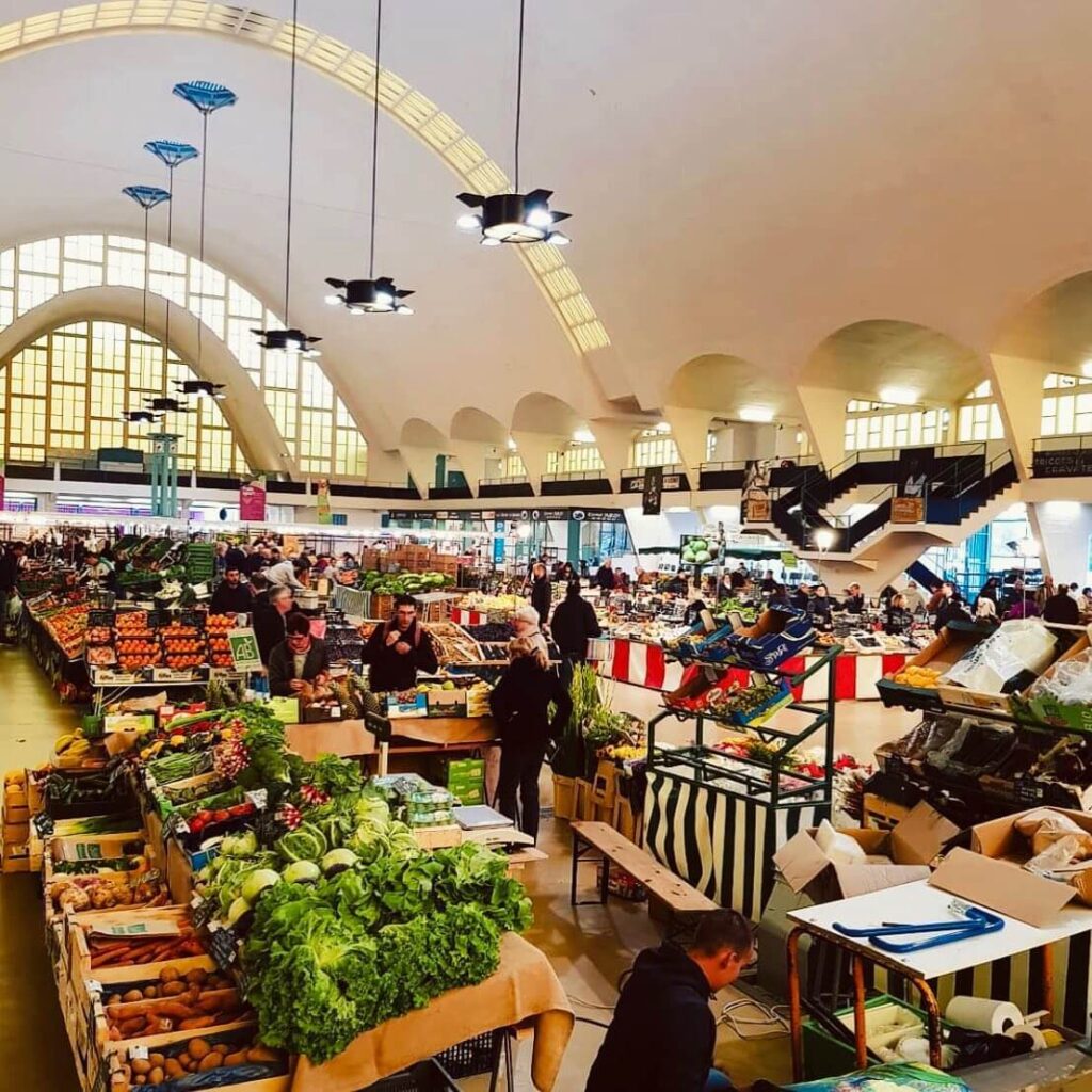 Morning scene inside Les Halles Market with local food stalls