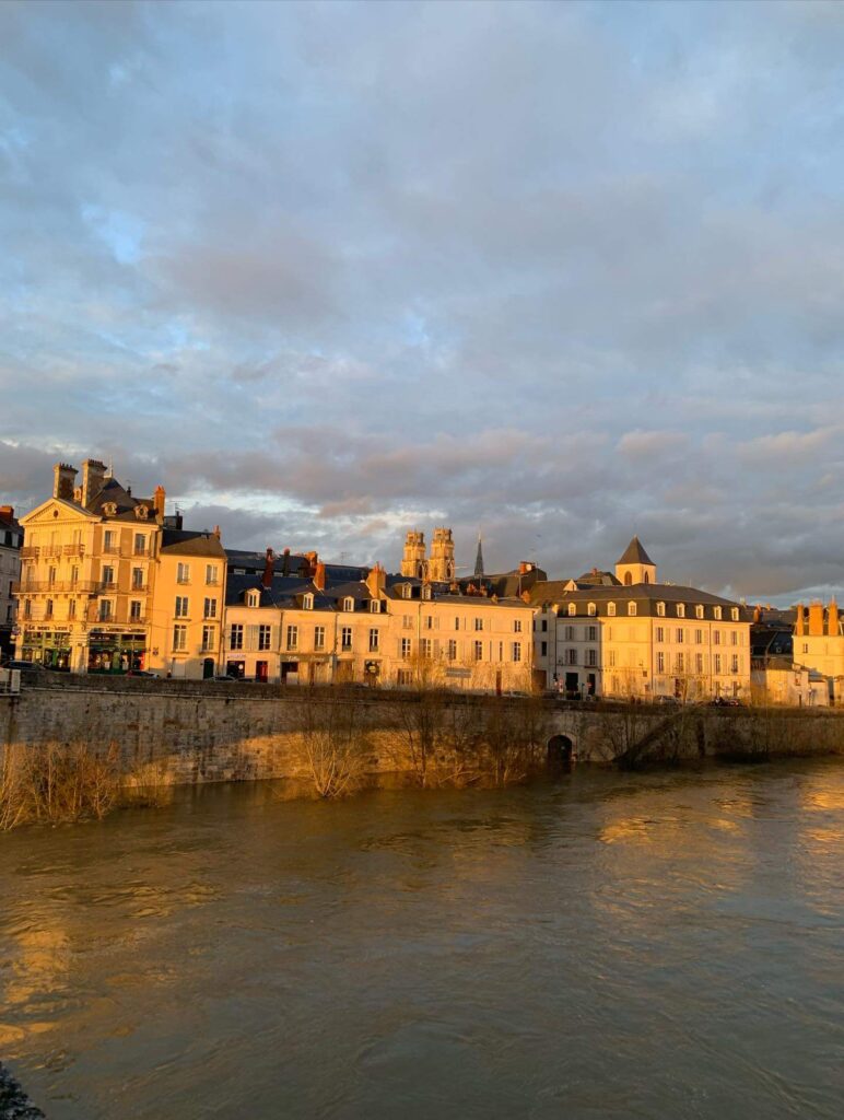 Sunset over Loire River in Orléans with warm colors and calm atmosphere