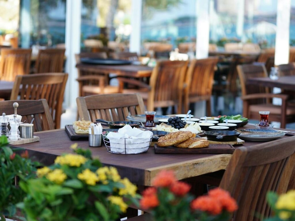 Outdoor dining at a mountain restaurant in Megève with alpine views