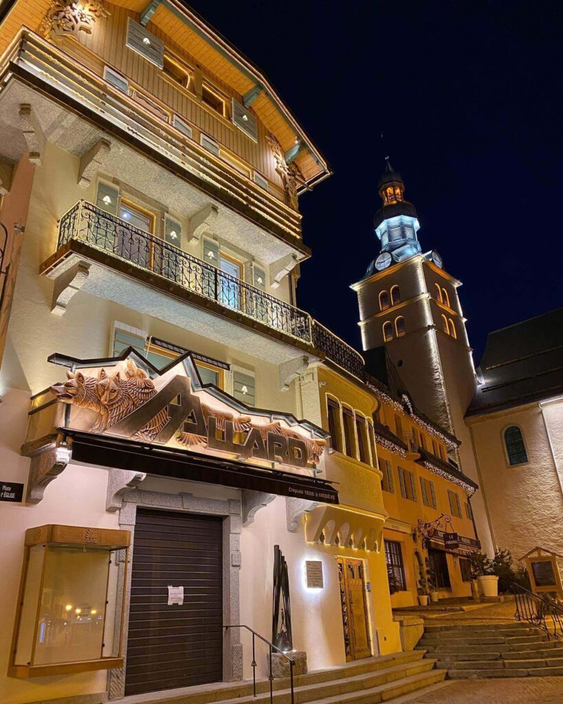 Quiet street in Megève village with warm lights during winter