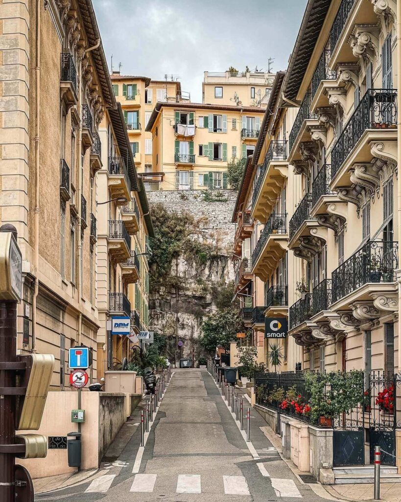 Narrow street in Monaco Ville old town with historic buildings