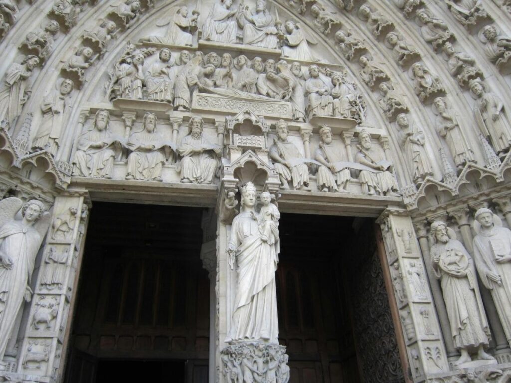 Damaged statues on Notre Dame cathedral facade during the French Revolution