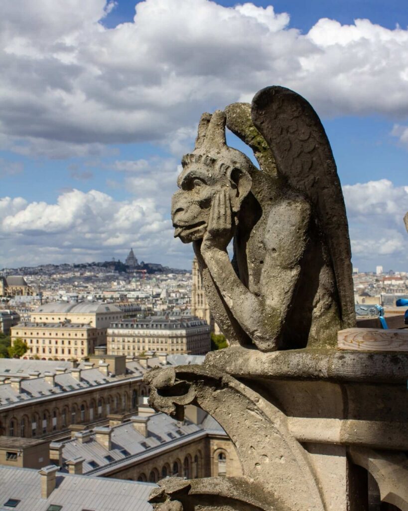 Gargoyle on Notre Dame cathedral overlooking Paris
