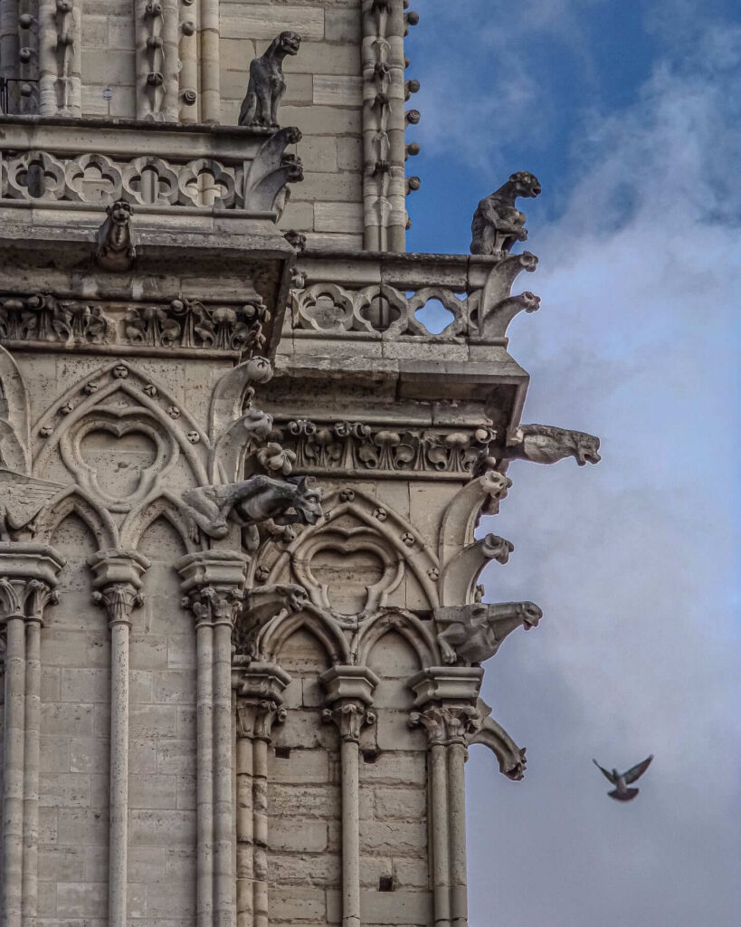 Gothic architectural details of Notre Dame de Paris showing arches and vertical structure