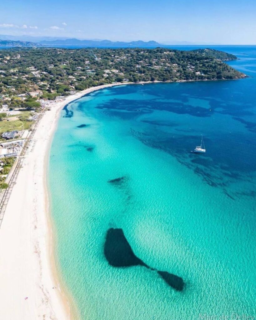 Pampelonne Beach in Saint Tropez with sunbeds and clear blue water