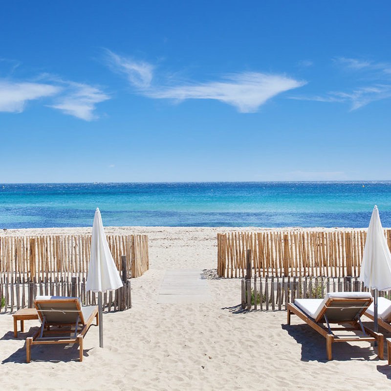 Pampelonne Beach with long sandy shoreline and clear blue water near Saint Tropez
