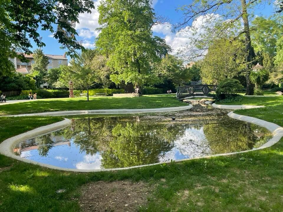 People relaxing in Parc de Blossac Poitiers during afternoon