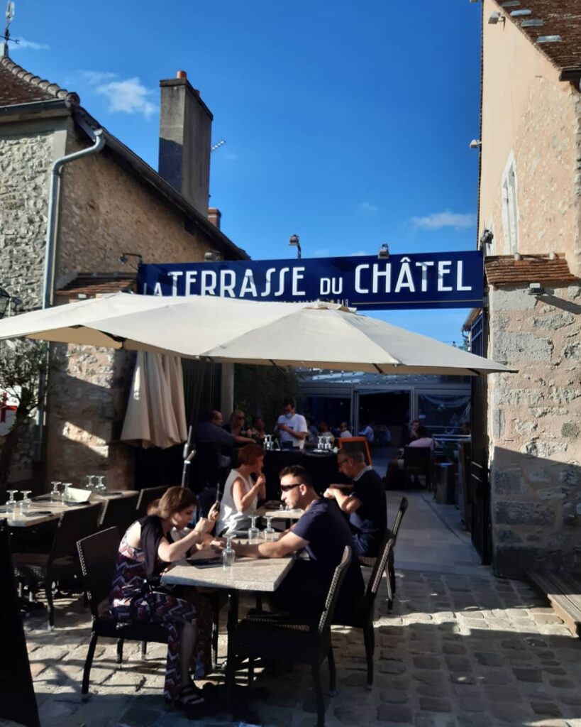 Place du Châtel in Provins with cafés and open square