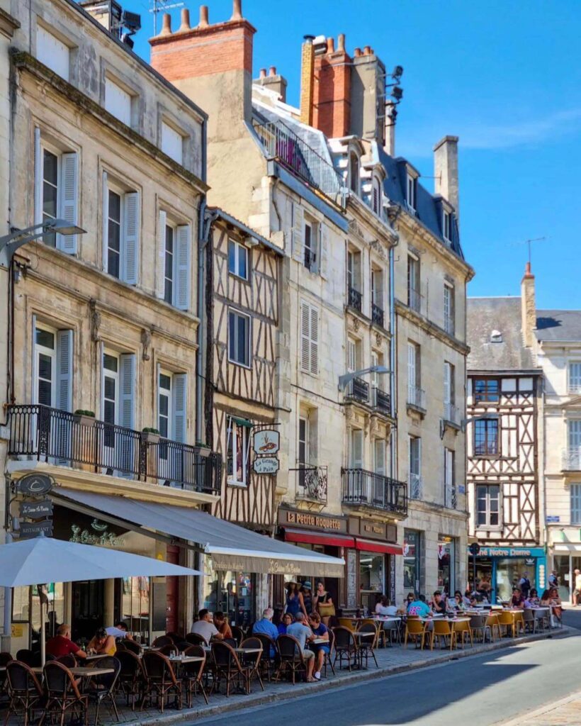 Quiet morning street in Poitiers old town with soft light and historic buildings