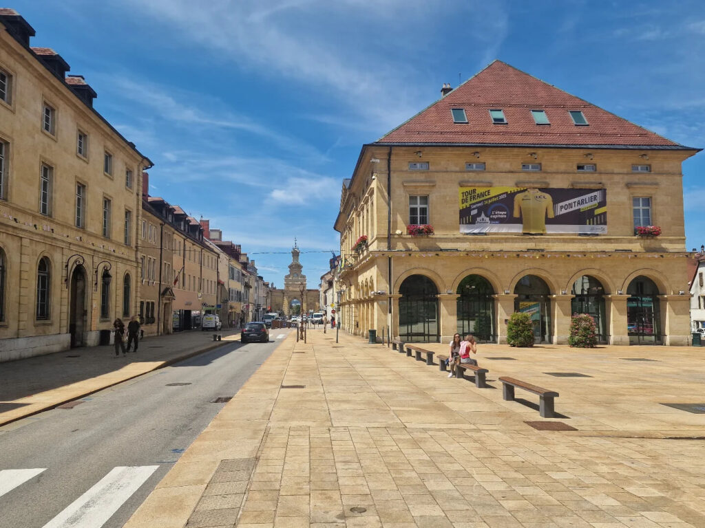 Walking through narrow streets in Poitiers old town with cafes and historic buildings