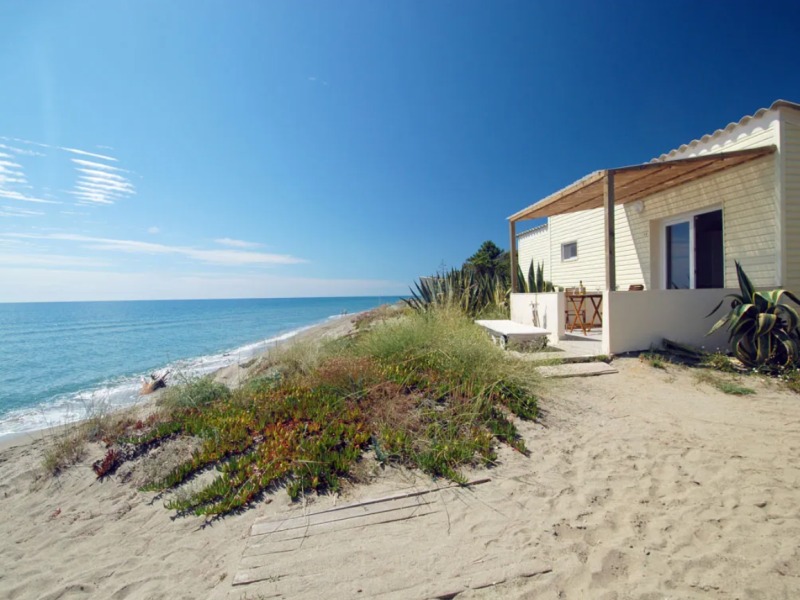 Beachfront stay near Porto Vecchio with clear water and coastal views