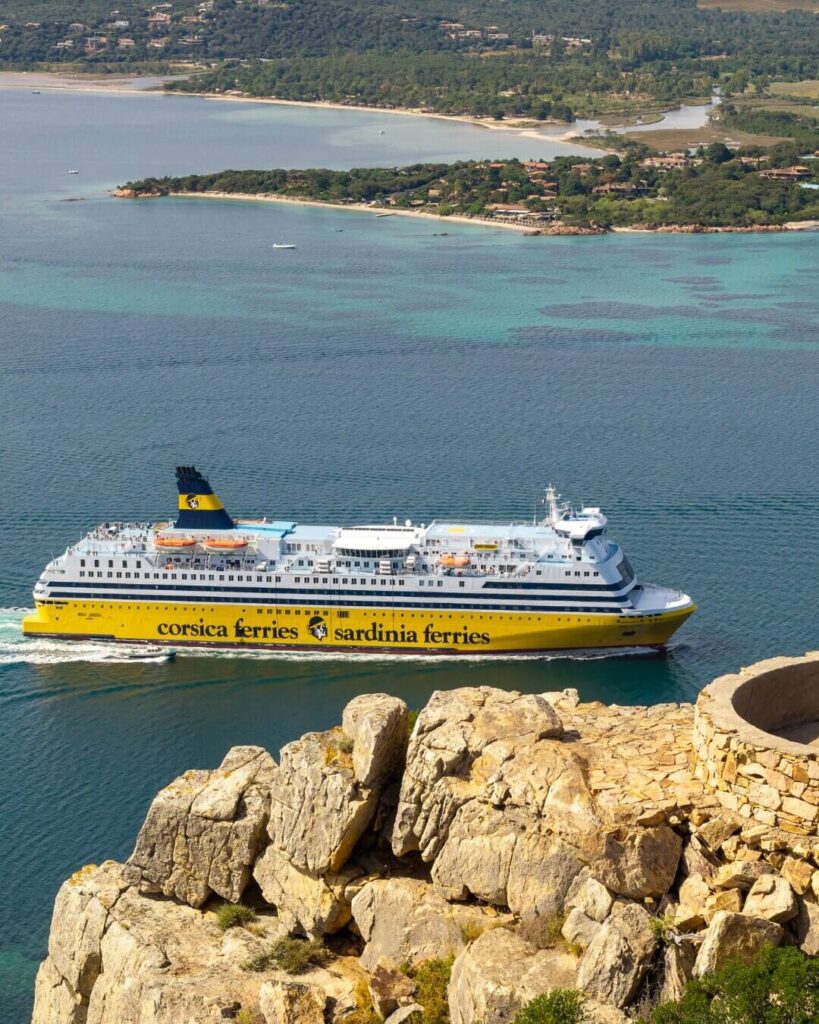 Boat view of Porto Vecchio coastline with rocky coves and clear water