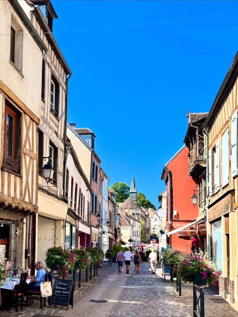 Walking toward the upper town of Provins in the morning along a quiet street