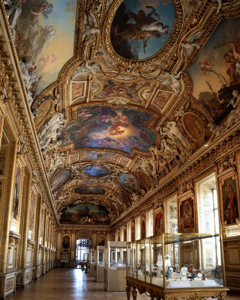 Quiet gallery inside the Louvre Museum with fewer visitors