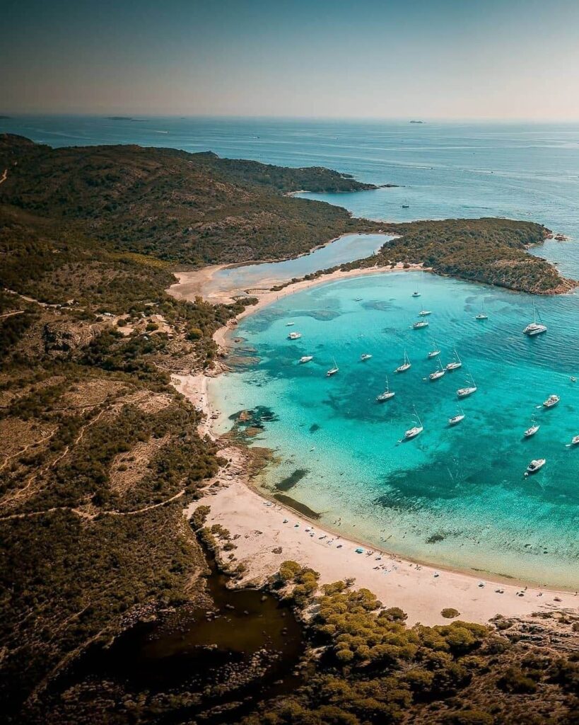 Rondinara Beach curved bay with calm water in Corsica