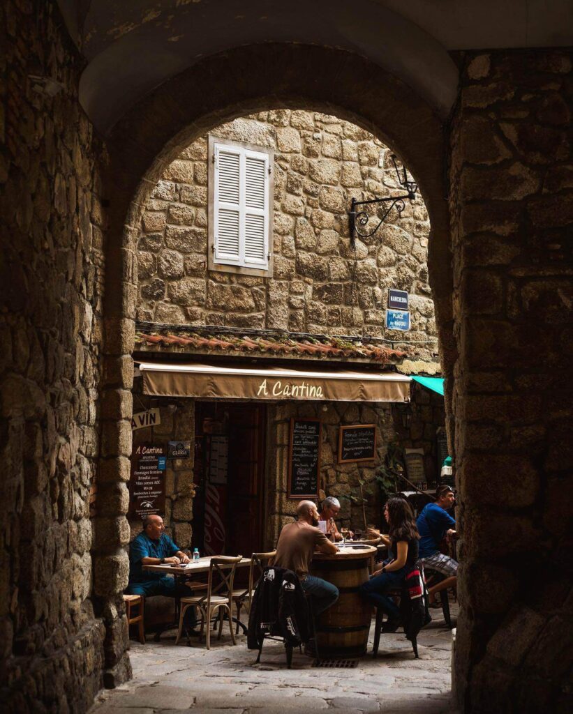 Outdoor café in Sartène main square with relaxed local atmosphere