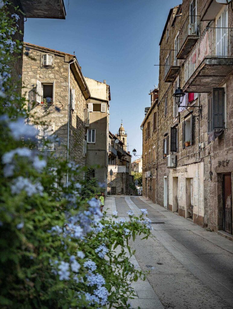 Sartène old town in the evening with warm light and people gathering