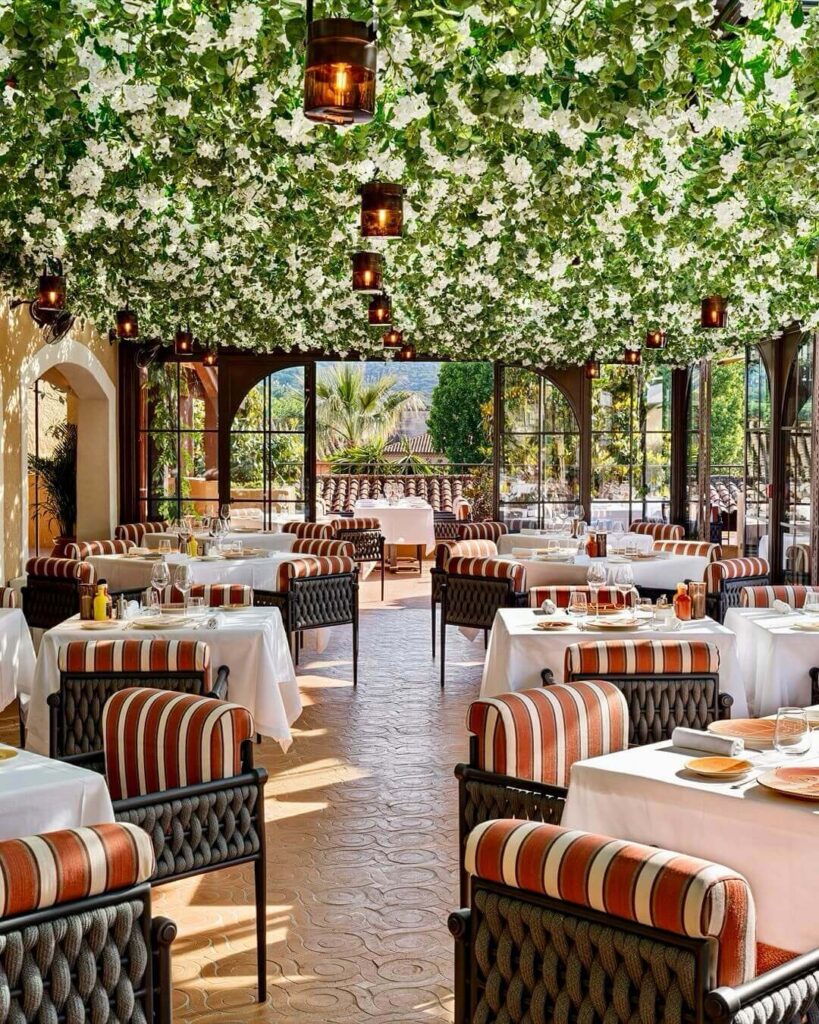 Outdoor seating at Sénéquier café by the harbor in Saint Tropez