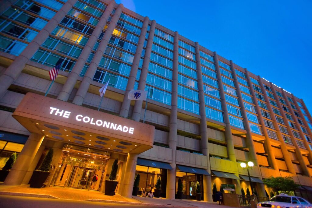 Exterior of The Colonnade Hotel in Boston Back Bay with modern glass facade