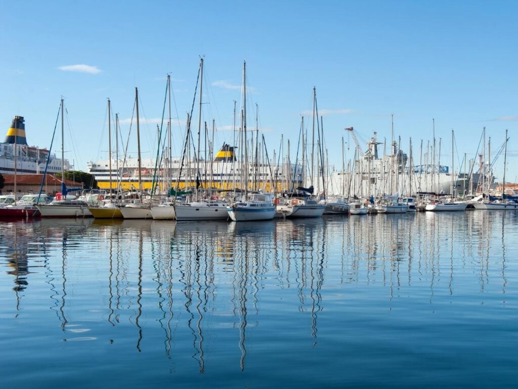 Toulon harbor with boats, waterfront promenade, and coastal views