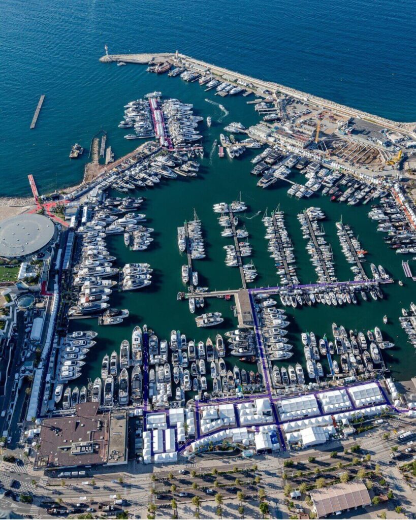 Colorful buildings along Bastia Old Port reflecting on calm water