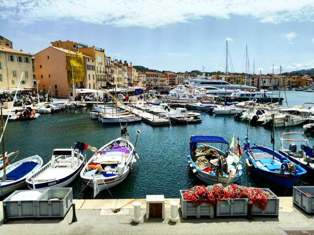 Saint Tropez harbor with yachts and waterfront cafes at Vieux Port