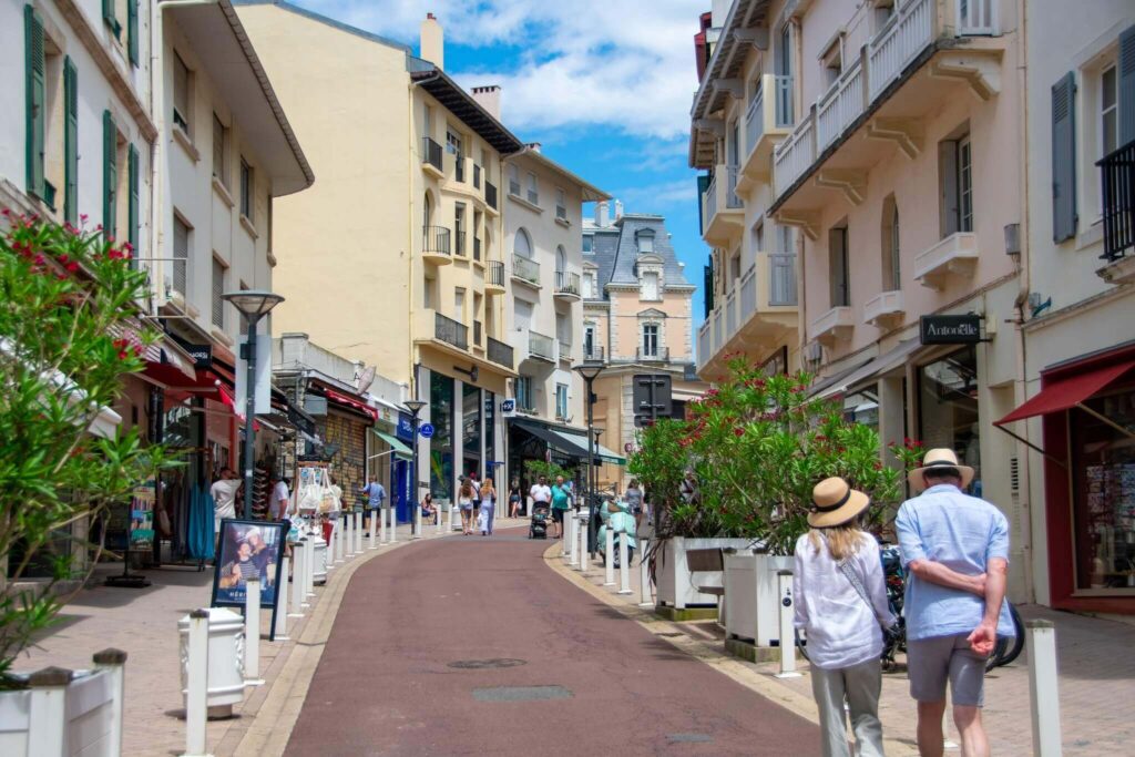 People walking through Biarritz town and promenade