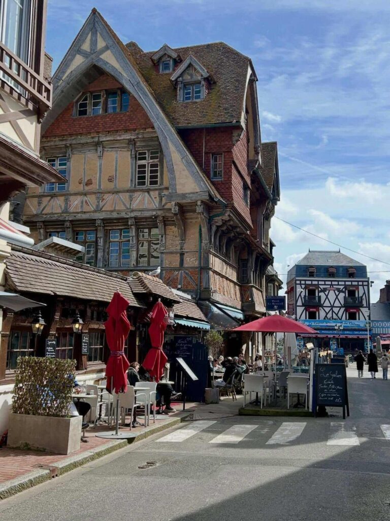 Walking through Étretat town streets near the beach