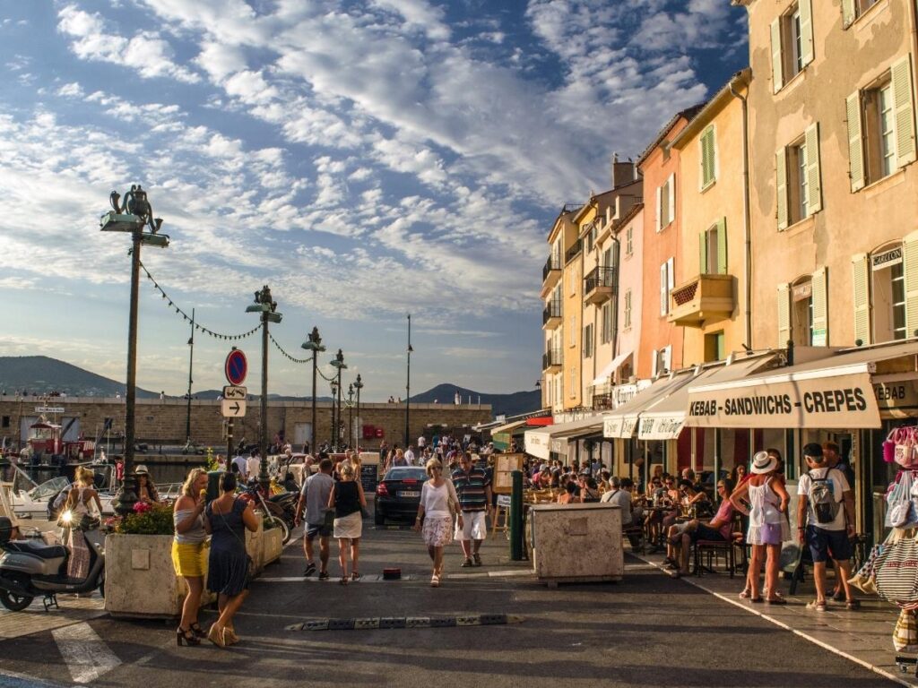 Walking through the old town streets of Saint Tropez near the harbor