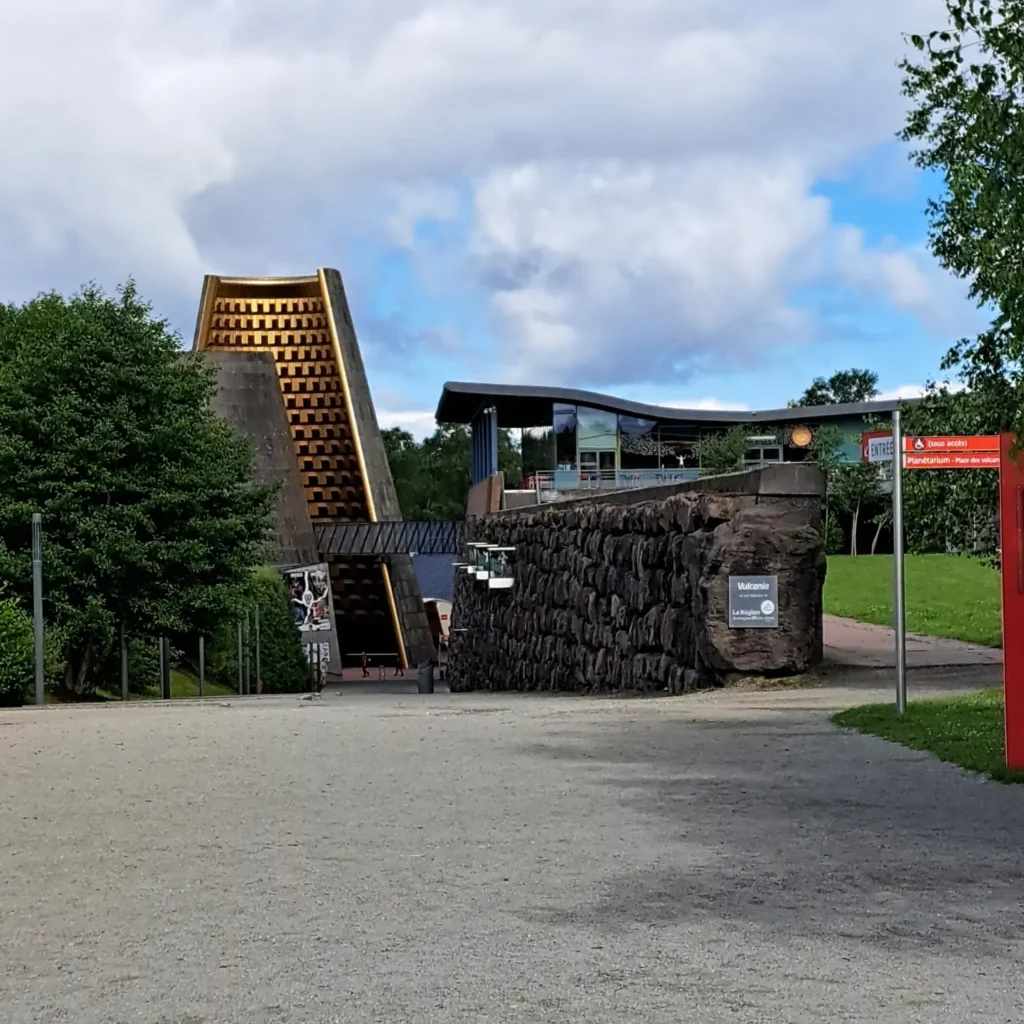 Modern architecture of Vulcania built into the volcanic landscape of central France