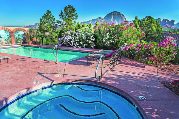 A Sunset Chateau boutique hillside retreat with panoramic red rock sunset views