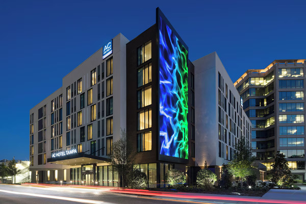 Sleek AC Hotel by Marriott Tampa Airport featuring contemporary European-inspired design, stylish guest rooms, rooftop lounge atmosphere, and modern accommodations near Tampa International Airport.