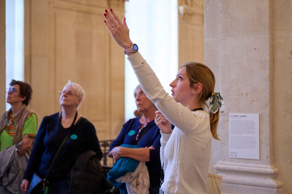 Visitor viewing Picasso artwork inside Musée Picasso