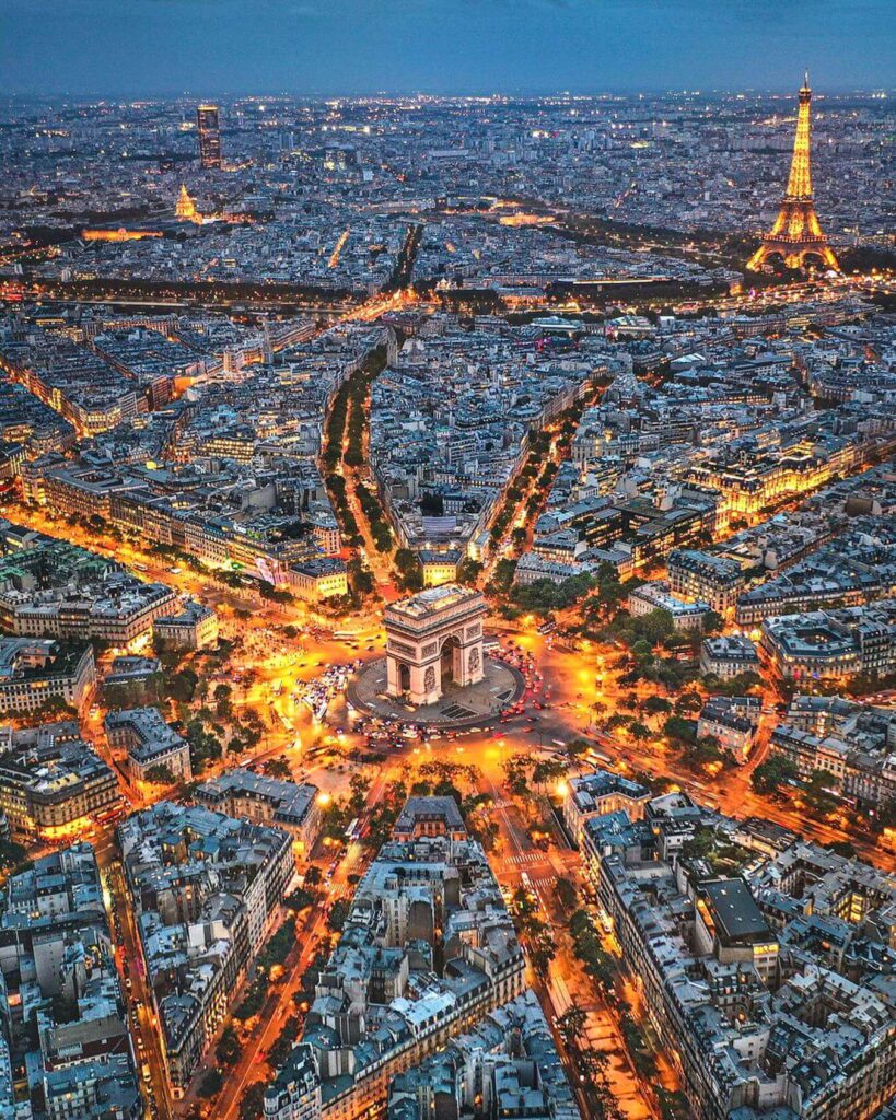Arc de Triomphe illuminated at night in Paris