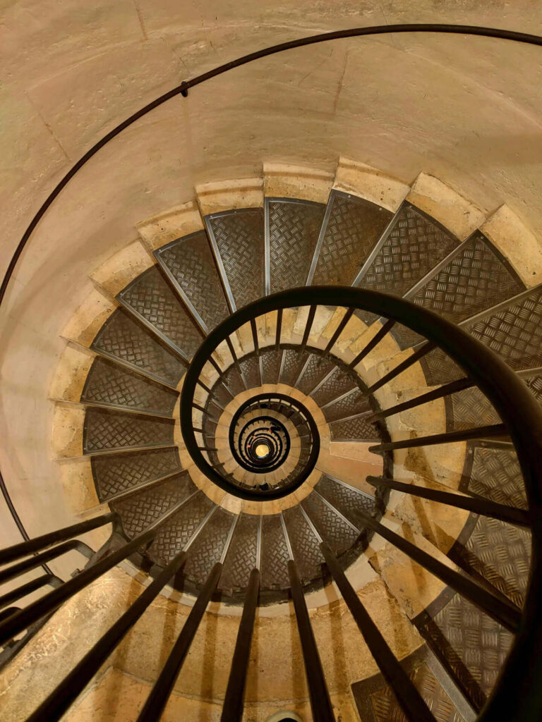 Spiral staircase leading to the Arc de Triomphe rooftop