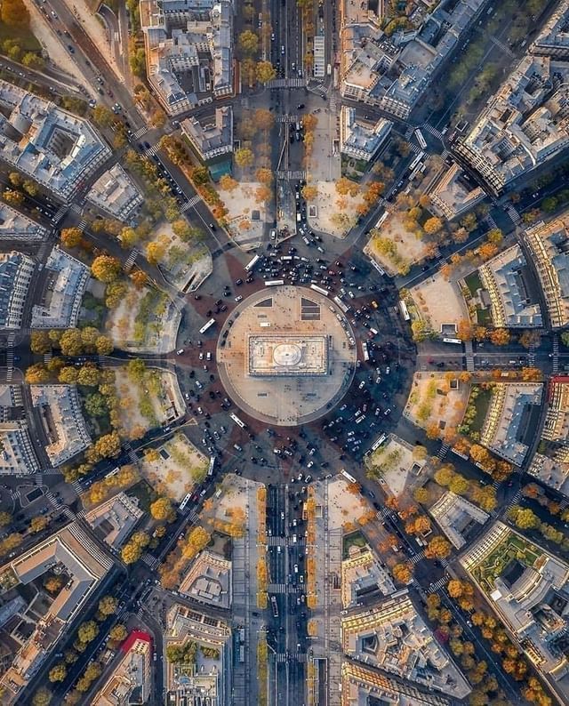 Aerial view of the Arc de Triomphe with twelve Paris avenues spreading outward
