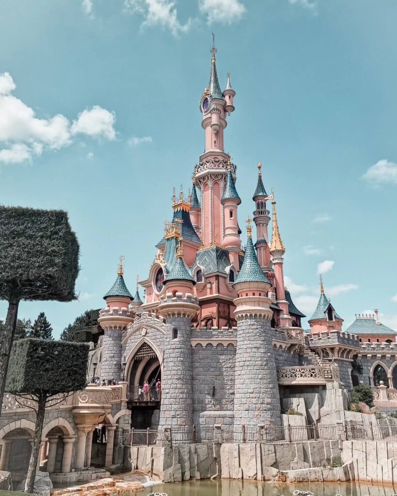 Sleeping Beauty Castle at Disneyland Paris during golden hour