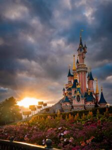 Sleeping Beauty Castle at Disneyland Paris during golden hour