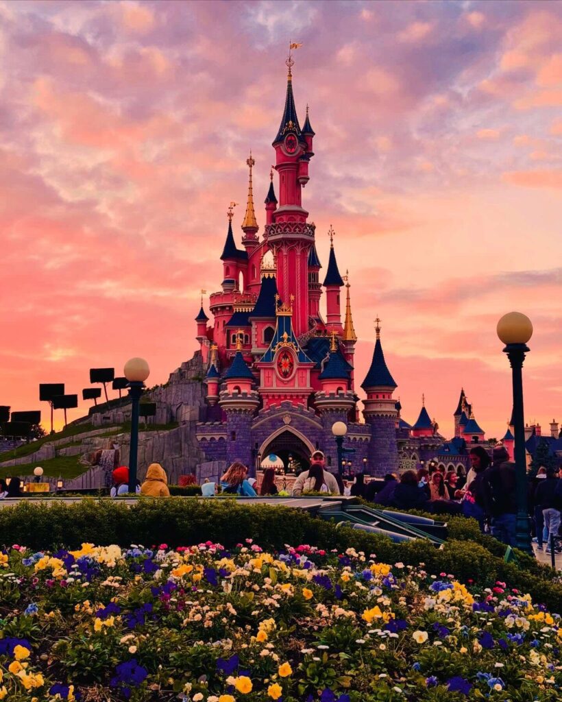 Disneyland Paris castle surrounded by spring flowers