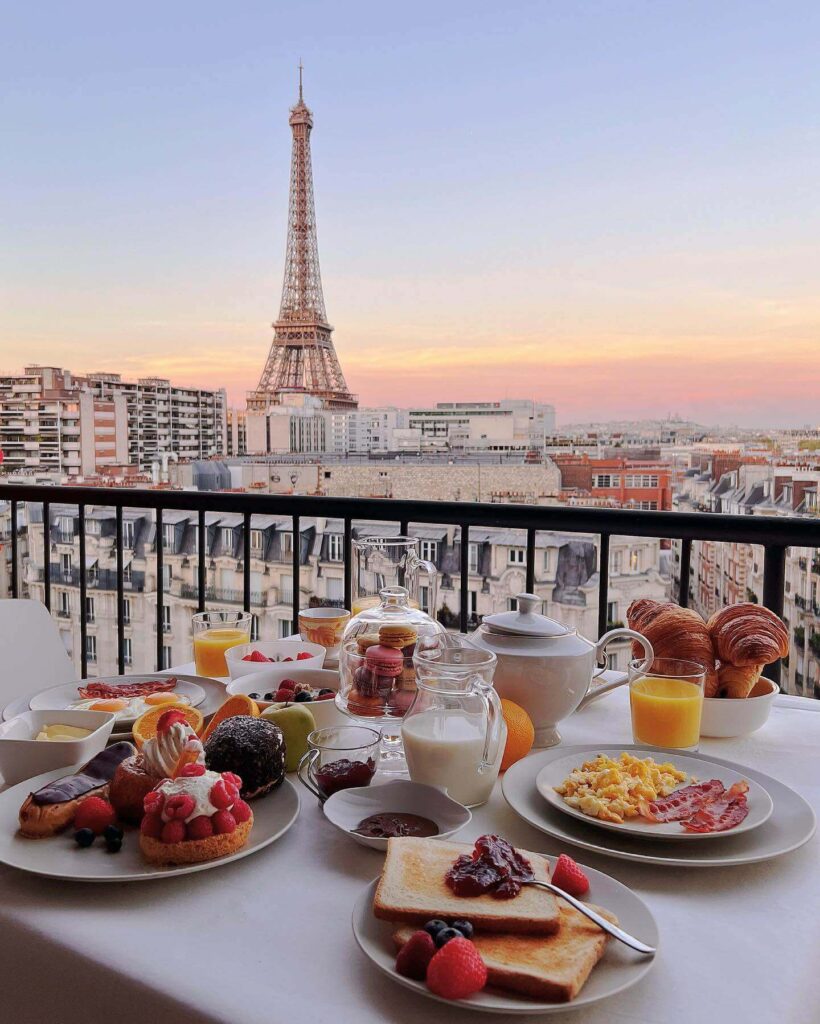 Eiffel Tower viewed from a rooftop terrace in Paris with city skyline