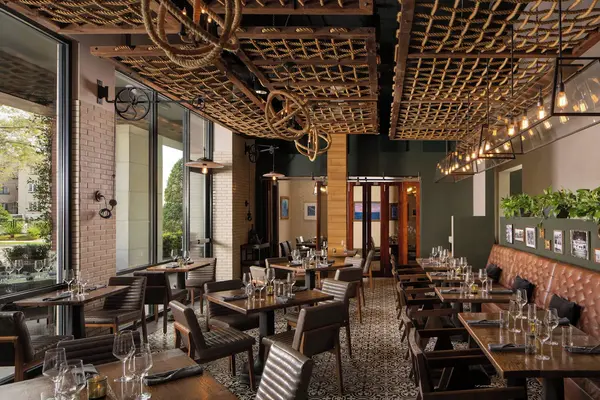 Luxury exterior view of Epicurean Hotel, Autograph Collection in Tampa, featuring stylish boutique architecture, upscale ambiance, modern interiors, and a sophisticated culinary-inspired hospitality experience.