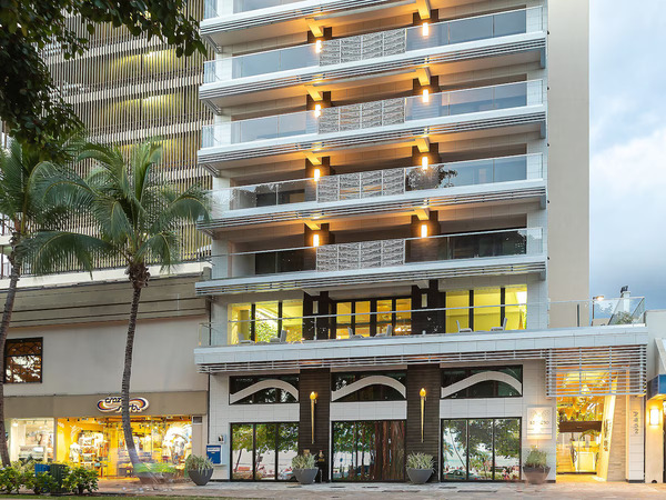 Upscale suite-style exterior of ESPACIO The Jewel of Waikiki featuring luxury accommodations steps from Waikiki Beach in Hawaii.