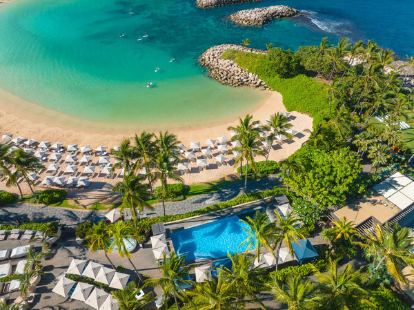 Luxury beachfront view of Four Seasons Resort O'ahu at Ko Olina featuring oceanfront pools, tropical landscapes, and upscale resort accommodations in Hawaii.