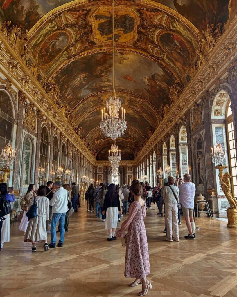 Crowded Hall of Mirrors at the Palace of Versailles during peak visiting hours