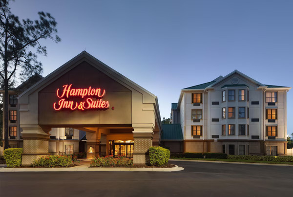 Modern Hampton Inn & Suites Tampa-North/USF featuring comfortable guest rooms, contemporary lobby design, outdoor swimming pool, and convenient accommodations near the University of South Florida.