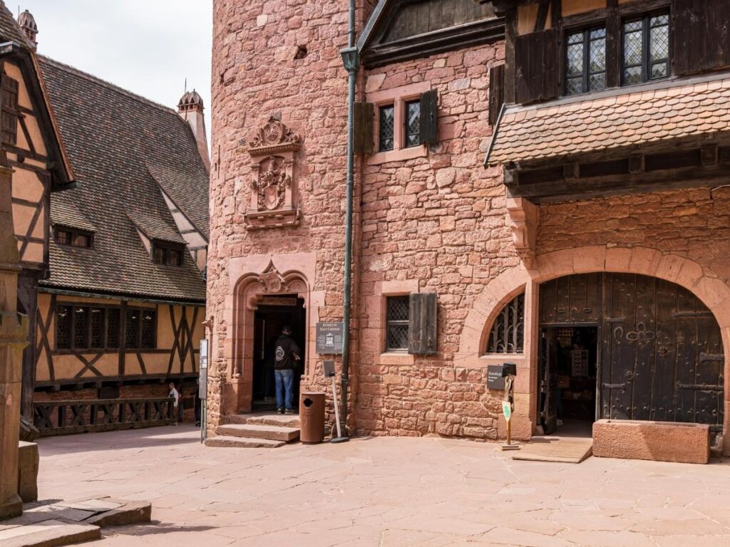 Visitors entering Château du Haut-Kœnigsbourg through the main gate