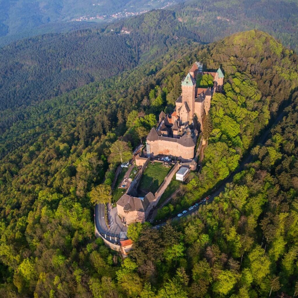 Traveler relaxing at a scenic viewpoint in Château du Haut-Kœnigsbourg