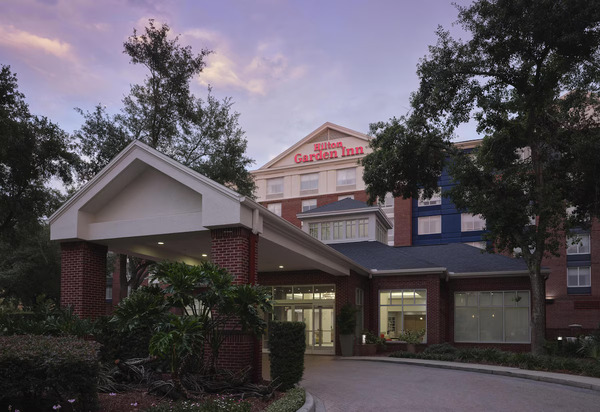 Modern Hilton Garden Inn Tampa East/Brandon featuring stylish accommodations, welcoming lobby interiors, outdoor pool area, and convenient access to Tampa and Brandon business districts.