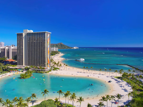 Oceanfront resort view of Hilton Hawaiian Village Waikiki Beach Resort with tropical Waikiki beachfront scenery