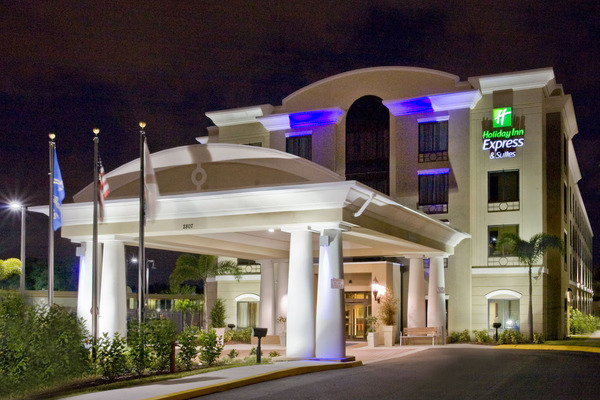 Contemporary Holiday Inn Express & Suites Tampa-USF-Busch Gardens featuring comfortable modern accommodations, bright breakfast area, outdoor pool, and convenient family-friendly stay near Busch Gardens Tampa Bay.